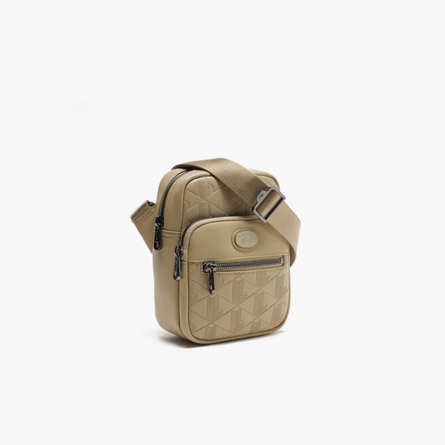Monogram Print Small Crossover Bag.- Dimensions: L5.1 x L7.2 x D2.7 in.- L13 x H18.5 x D7 cm.- Exterior in Split Calfskin Leather.- Adjustable strap: 75cm - 140cm - 29.5 - 55 in.- 2 zipped outside pockets, 1 mesh inside pocket.- Enamel plaque with crocodile logo. Material: 100% Split Calfskin Leather. Ref: NH4399MRC87.