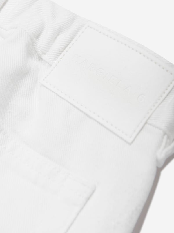 Introducing the Kids Metallic Effect Jeans in Silver from mm6_maison_margiela, a high-end designer piece for your Boy or Girl. Enhance their style quotient with these key features: Bold and shiny: These metallic effect jeans are sure to grab attention with their bold and shiny look. They're the ultimate statement in kids' fashion.  Comfortable Fit: Crafted from high-quality materials that conform to the body comfortably, these jeans are perfect for all-day wear. Unisex Design: Suitable for both Boys and Girls, these unique jeans fits seamlessly into any junior wardrobe.Revamp your child's fashion game with these lavish Kids Metallic Effect Jeans in Silver. Let them shine bright with mm6_maison_margiela! Order today.