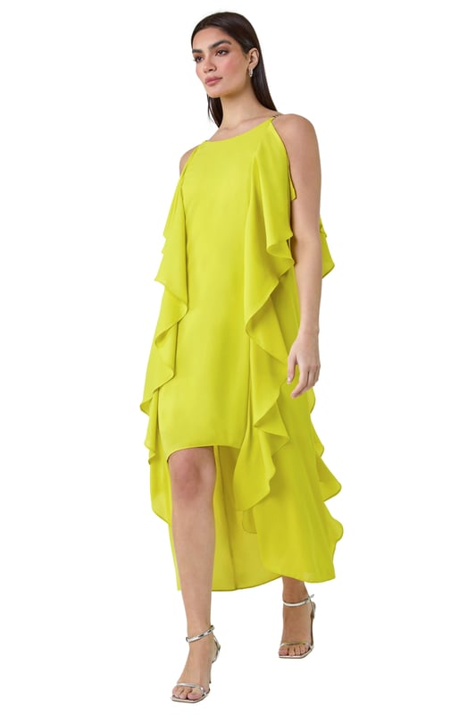 Plain Dipped Hem Ruffle Detail Midi Dress from Roman. Elevate your Summer wardrobe with this striking ruffle detail midi dress from the Ariella range. Featuring a elegant, cascading waterfall ruffle detail, this dress has a striking hi-low silhouette to add a touch of drama to your occasionwear. This sleeveless dress with a concealed back zip fastening is crafted from plain woven fabric and fully lined for maximum comfort. The metal trim on the shoulder straps provides a sophisticated edge. Whether you're attending a wedding or a formal dinner, style it with strappy heels and a clutch bag for event-ready glamour!