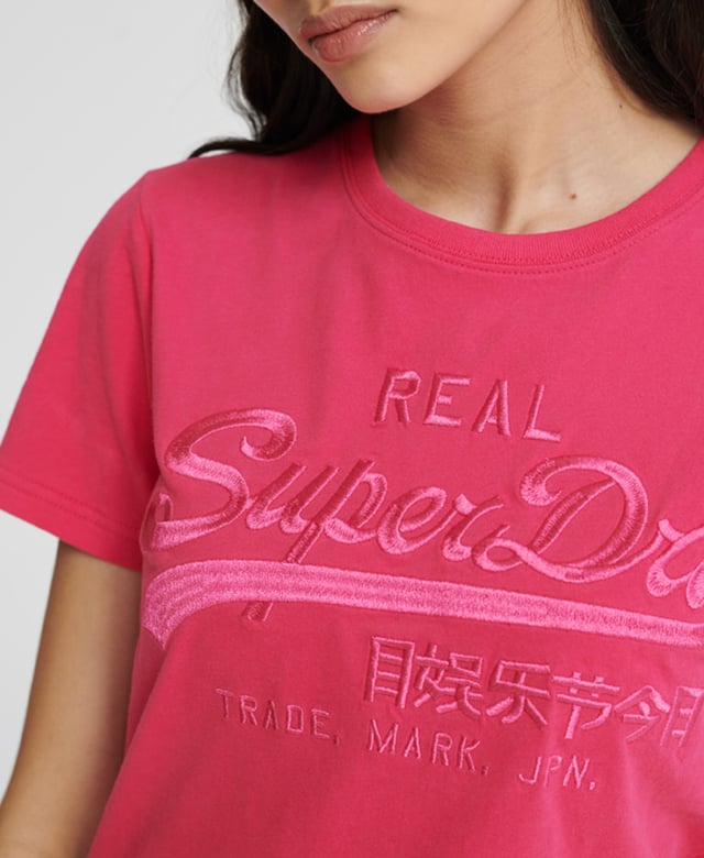 Superdry Vintage Logo Tonal Embroidery T-Shirt Superdry women's Vintage Logo tonal embroidery t-shirt. This classic short sleeved tee features a crew neckline, and is finished with a large embroidered Superdry logo across the chest.Slim fit – designed to fit closer to the body for a more tailored look