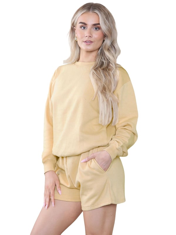 Introducing the Kruze Womens Tracksuit Set: a stylish and comfortable tracksuit set for women. The regular fit crew neck sweatshirt features ribbed waist and cuffs, while the soft fleece lining adds an extra layer of comfort. The accompanying shorts also feature a regular fit and an elasticated waistband with an adjustable drawstring for the perfect fit. Elevate your activewear game with this must-have set!