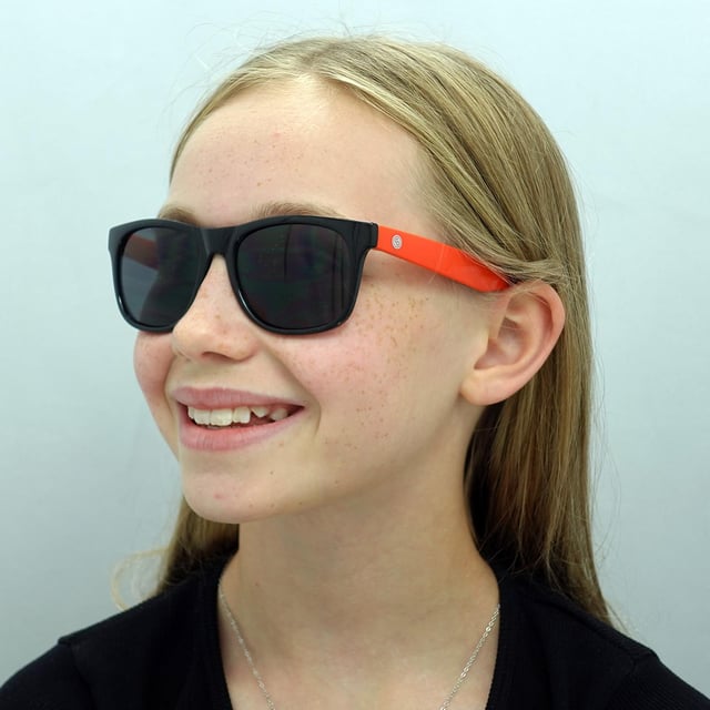 Smarty Rectangle Kids Black Orange Grey X2133  Sunglasses Equip your child with stylish and reliable protection with SMARTY Designer Sunglasses model X2133A, perfect for youths aged 7 to 11 years old. These rectangular-shaped sunglasses feature a sleek black frame with vibrant orange plastic arms and grey lenses, offering superior UV protection and a bold, modern look. The X2133A model combines trendy design with youth-friendly comfort and durability, making them ideal for any outdoor adventure. Available at an unbeatable discount from the regular retail price, these designer sunglasses provide exceptional quality and value. Give your child the perfect blend of style and safety with SMARTY sunglasses.