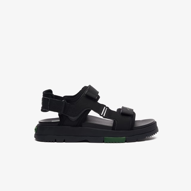 • Padded neoprene cushioning under straps • Synthetic leather footbed • Rubberised print Lacoste wording to front strap • Crocodile heel branding to rear strap • Lightweight rubber outsole with colour-blocked sections.