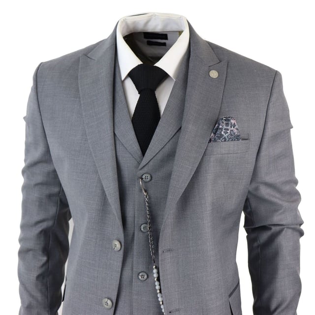 Step into sophistication with our Classic and Elegant Design men's 3-piece suit, featuring a timeless Grey color with contrasting pocket trims and a sophisticated textured pattern fabric, perfect for formal occasions. Product Design Bullet Points:  
Versatile Formal Attire: Suitable for weddings, business events, or special occasions, ensuring a sharp and well-dressed look. 
Complete 3-Piece Set: Includes a jacket, vest, trousers, and pocket chain for a polished and coordinated outfit. 
Premium Material: Crafted from high-quality materials for comfort and durability, ensuring long-lasting style. 
Sophisticated Textured Pattern Fabric: Adds a touch of elegance and refinement to your formal ensemble. 
Contrasting Pocket Trims: Enhances the visual appeal of the suit, adding depth and dimension to your look.  Made from a blend of 65% Polyester, 32% Viscose, and 3% Lycra for a comfortable and stylish finishSizes	Jacket & Trouser Size
36R :	36" (Chest) 30" (Waist)
38R :	38" (Chest) 32" (Waist)
40R :	40" (Chest) 34" (Waist)
42R : 	42" (Chest) 36" (Waist)
44R :	44" (Chest) 38" (Waist)
46R : 	46" (Chest) 40" (Waist)
48R :	48" (Chest) 42" (Waist)
50R :	50" (Chest) 44" (Waist)
52R :	52" (Chest) 46" (Waist)
54R :	54" (Chest) 48" (Waist)