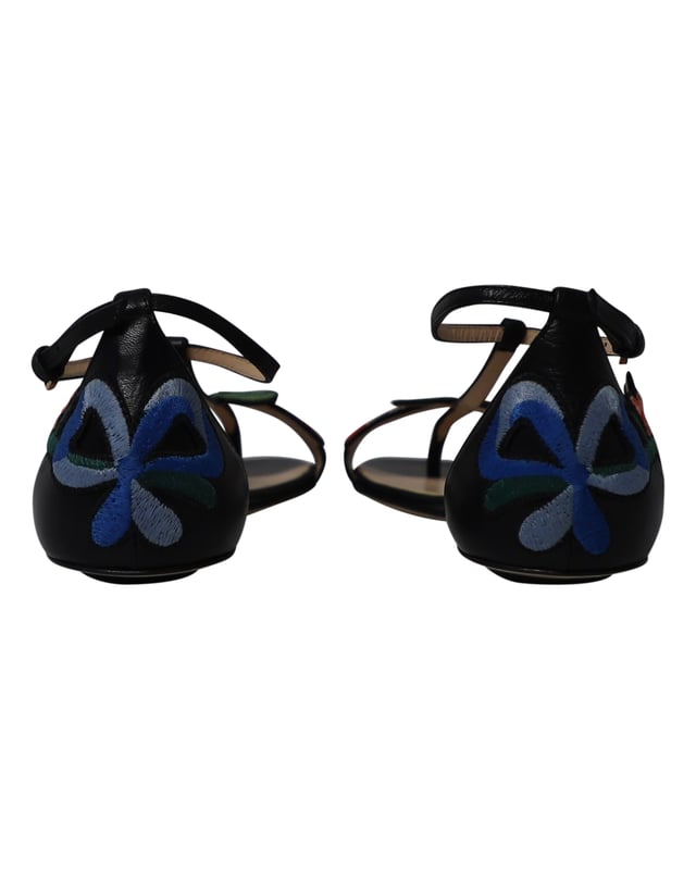 VINTAGE, RRP AS NEW
Wear luxury with a touch of high-fashion by choosing these black flats from Gucci. They are crafted from leather in an open toe T-strap silhouette and detailed with floral embroidered patches that extend from the vamps to the counters. They are complete with buckled ankle straps and comfortable leather-lined insoles.

Gucci Ophelia Floral-Embroidered Flat Sandals in Black Leather 
Material: Leather
Color: Black
Size: IT35/UK2
Condition: Excellent
Sign of wear: No
SKU: 252653
