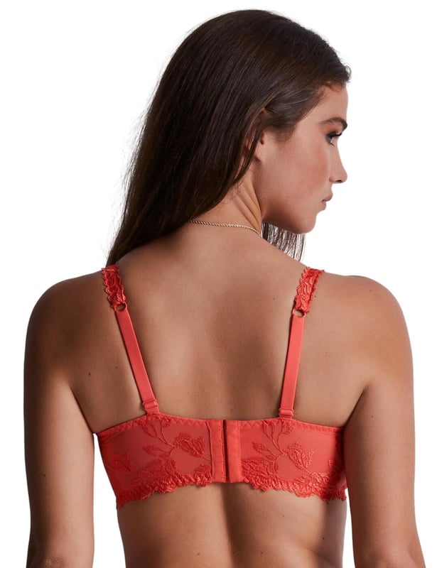 Welcome to the world of luxury lingerie with the Aubade Softessence triangle bra, a stunning half-cup bra designed to make you feel confident, comfortable, and oh-so-stylish. Crafted with intricate floral embroidery, this bra blends femininity with sensuality. The delicate blooms dance across the soft tulle mesh, creating a mesmerizing effect that is both alluring and dreamy. But luxury doesn't have to mean sacrificing comfort. That's why this bra is underwired for unbeatable support while remaining non-padded for a natural look and feel. A lace-up design adds a playful, flirty touch to this stunning piece. And let's not forget about the cute bow at the centre front, adding a touch of charm. The decorated adjustable shoulder straps ensure that this bra will stay in place all day long, providing you with comfort and support. Plus, there are now matching briefs available to complete this glamorous look.

Half cup bra
Floral embroidery design
Semi-sheer tulle mesh
Scalloped edging
Underwired for support
Non-padded for comfort
Lace-up design
Cute bow at the centre front
Decorated adjustable shoulder straps
Hook and eye closure
Matching coordinates available
Country of origin: Tunisia
Composition: Cup embroidery: 64% Polyester | 36% Polyamide
Composition: Back embroidery: 47% Polyester | 38% Polyamide | 15% Elastane
Composition: Centre embroidery: 46% Polyamide | 35% Polyester | 19% Elastane
Composition: Lining: 100% Polyamide
Listed in UK sizes
 Half Cup Bra