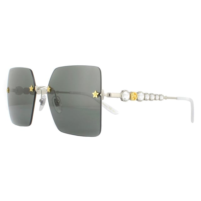 Gucci Sunglasses GG0644S 001 Silver Greyare incredibly glamorous with the large rimless square lenses set into the frame with star details screws. Leage crystal feature down the temples alongside the GG logo to great effect..