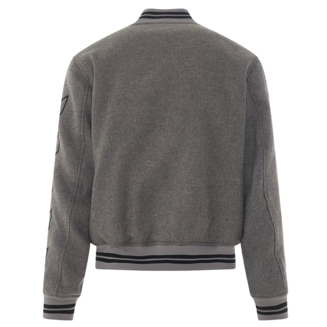 Off-White Diag Outline Grey Varsity Jacket. Elevate your style with the Off-White Grey Varisty Jacket. This Italian-made jacket features a sleek drag outline design, perfect for those who appreciate attention to detail. Show off your fashion expertise and stay on trend with this must-have statement piece.. Pop Button Closure, Brand logo On Chest, Made In Italy, Off-White Grey Jacket. 2 Open Front Pockets, Diag Design On Arms. 38% Cotton, 32% Wool, 14% Acrylic, 11% Polyamide, 5% Alter Fibre. Style Code: OMEA315C99FAB0010810