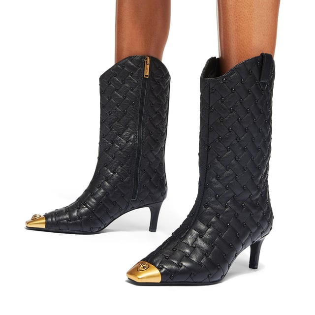 This Kurt Geiger Regent Ankle Boot features a black leather upper with antiqued brass toe cap. There is an antiqued brass eagle head sat on top of the toe all sat on a fashionable kitten heel. Heel height: 6.5cm.
