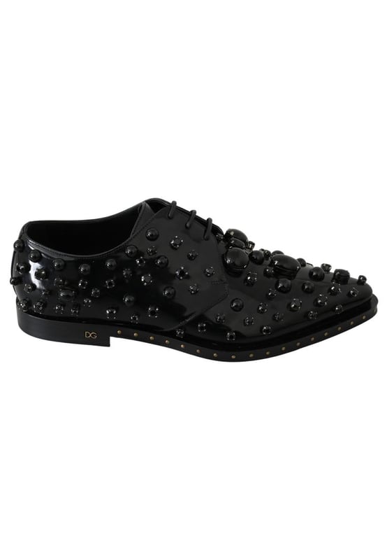 Zapatos De Vestir De Cristal De Cuero Modelo: Zapatos de vestir.
Color: Negro.
Material: Cuero.
Cristales negros.
Suela de cuero.
Detalles del logotipo.
Fabricado en Italia.
Muy exclusivo y de alta artesania.