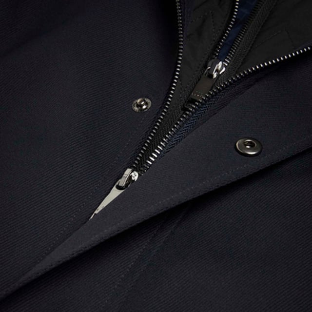 Men's Ted Baker Erolson Funnel Neck Coat in Navy.- Funnel neck.- Zip and popper fastening.- Pockets.- Removable quilted lining.- Mid-length.- Material: 100% Polyester. Ref: 272518NAVY.