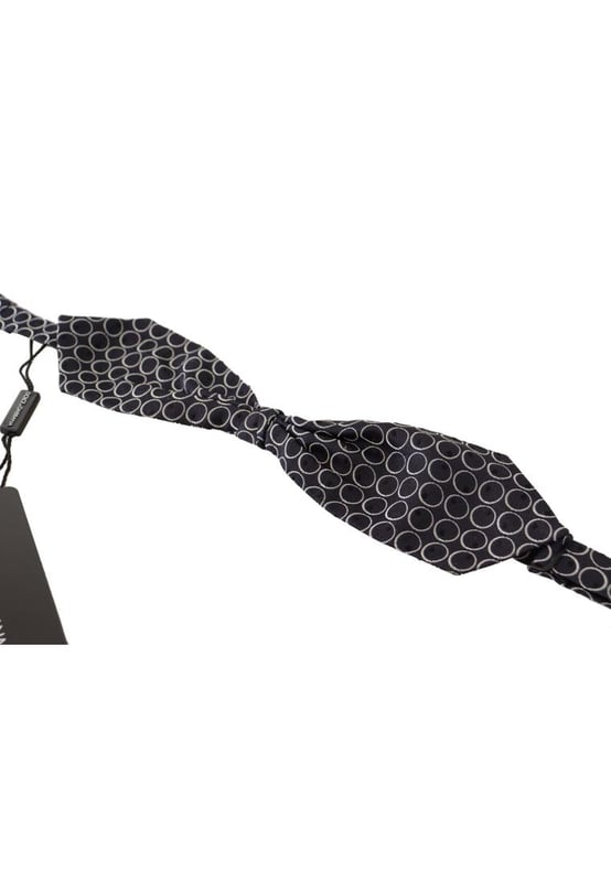 Stunning Dolce & Gabbana bow tie
  Color: Black and White Round
  Model: Tied
  Material: 100% Silk
  Adjustable length neck strap
  Made In Italy
  Width: 7cm