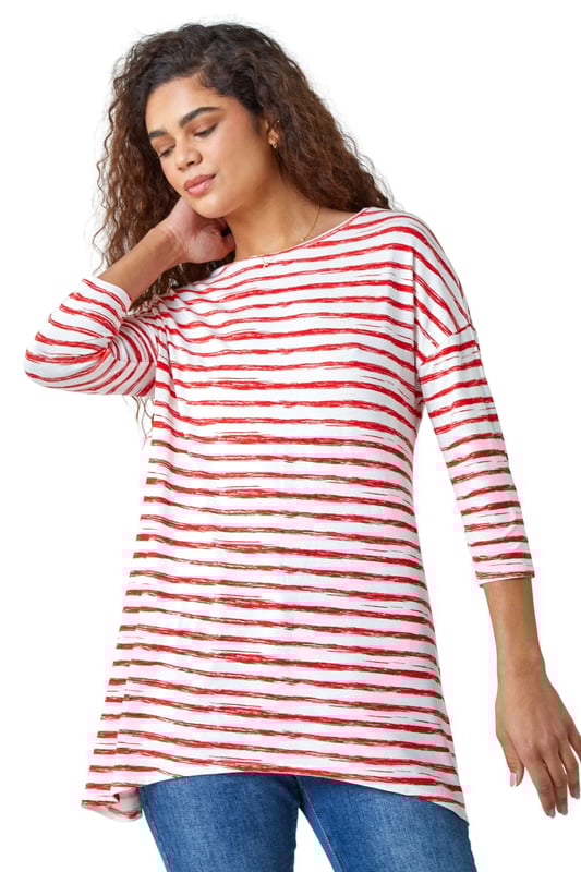 Abstract Stripe Print Stretch Top from Roman. Stripe it lucky this Spring with our newest casual top. Keeping the warmer weather in mind, this striped top is cut from a lightweight stretch jersey for a comfortable style that’s designed for all day wear. It has a modest round neckline, 3/4 length sleeves and a playful hanky hemline that makes it great for transitioning into the new season. A broken stripe print adds a new twist to the timeless nautical trend. Wear with jeans and trainers for the perfect Summer day style.