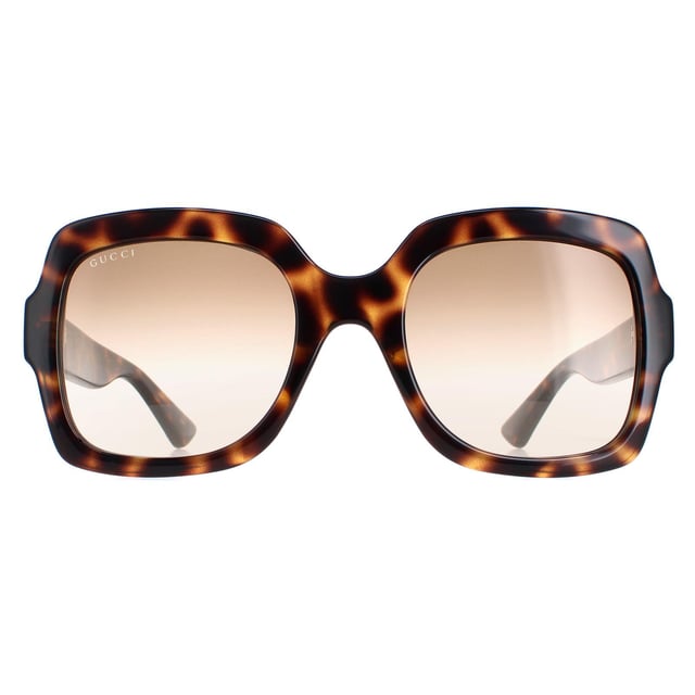 Gucci GG1337S 003 havana bruin gradiÃ«nt zonnebril is een modieus en tijdloos accessoire dat elke outfit zal verheffen. Deze zonnebril heeft een vierkante, retro vorm met een lichtgewicht acetaat montuur en het iconische GG logo op de slapen. Perfect voor iedereen die op zoek is naar een vintage-geÃ¯nspireerd accessoire dat luxe en stijl uitstraalt. Deze zonnebril is een must-have voor elke fashion-forward persoon.