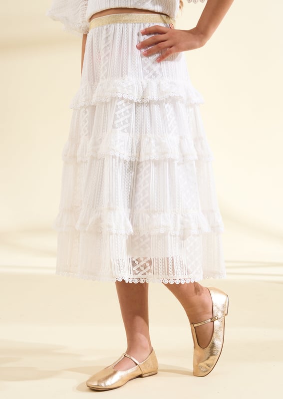 Add a delicate piece to their occasion wardrobe with our all over mesh lace midi skirt. Cut from vintage white mesh lace featuring a metallic waistband which falls into a tiered midi silhouette. Wear with our matching shell top for the prettiest outfit.. About Me: Shell- 100% Nylon. Lining- 100% Polyester. Look After Me: Think Planet. Wash At 30C.