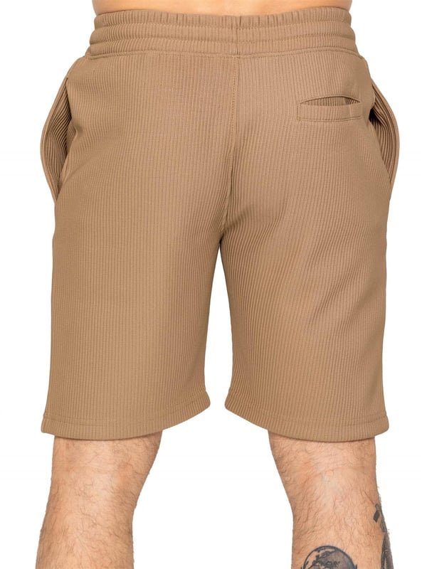 Elevate your summer style with our Enzo Milano Men's Outfit Set, including a textured ribbed revere shirt and relaxed fit shorts. Experience ultimate comfort with a button fastening and adjustable drawstring waistband, while looking effortlessly stylish with a revere collar and single back welt pocket. Made with premium fabric, this set is perfect for any occasion.