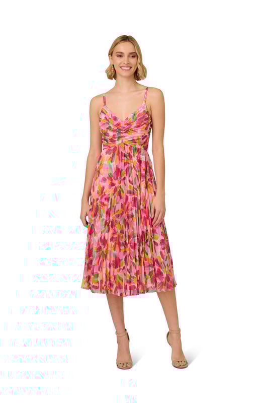 Romantic design details flourish throughout this midi dress. This dress features a shirred bodice with tank straps, v-neckline, and pleated soft skirt. Crafted from lightweight chiffon that is covered in a bright, abstract floral print, this dress has limited stretch and a waist seam. A scoop back and hidden zipper closure completes this midi dress. Pair this dress for day with a simple sandal or dress it up for a cocktail attire event with metallic heels and sparkling accessories.