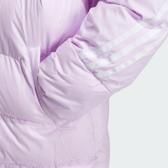 Made from sturdy ripstop and padded for warmth, this juniors' adidas jacket is your go-to during the colder months. Designed to keep the elements at bay without weighing you down, this long jacket offers plenty of coverage as you venture outdoors. A hood shields you from rain, while pockets keep your belongings tucked away. This product is made with 100% recycled materials. By reusing materials that have already been created, adidas help to reduce waste and our reliance on finite resources and reduce the footprint of the products adidas make.  - This model is 152 cm and wears a size 11-12Y. Their chest measures 70 cm and the waist 60 cm. - Regular fit - Full zip with hood - 100% polyester (recycled) - Front pockets - Self-fabric cuffs  Shipped by adidas