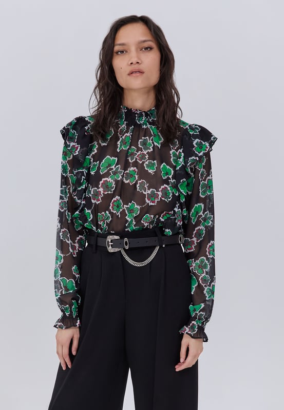 Black blouse in polyester voile for women. High collar with smocks, long elasticated sleeves. Exclusive IKKS floral maxi print. Ruffle details on front and back. Back gutter closed by buttons. Straight and fluid cut.