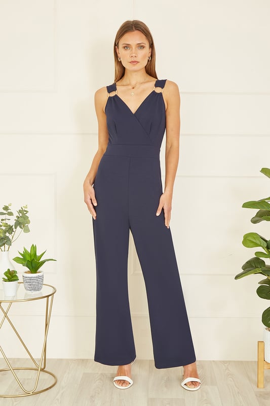 Stay bang on trend at any invite this season in this Mela jumpsuit. The all in one design has been crafted from a stretch fabric to ensure you can be mega stylish and comfortable for those all day events. With a wrap over neckline, and gold buckle details on the straps, finish this flattering wide leg fit with a pair of heels.