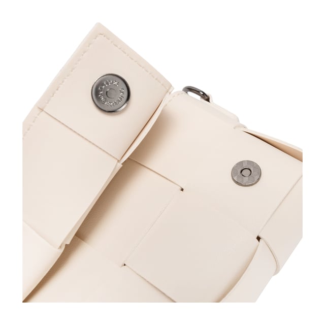 *Bags* of potential This Lana cross body features intricate cut-outs and woven detailing for a sophisticated stylish look. Magnetic fastening is secured with the fold-over flap top. Detachable and adjustable strap means you can wear this as a cross-body or as a clutch.