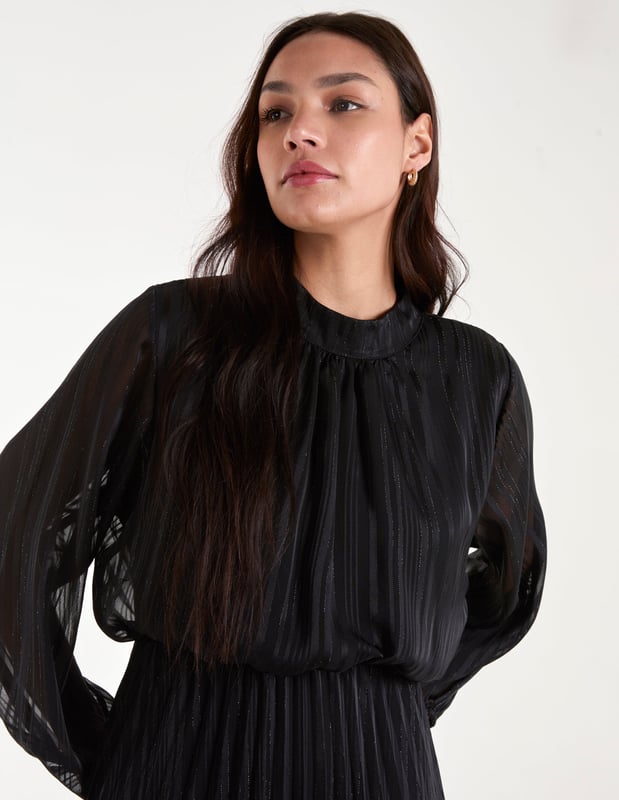 The dress that screams nothing but Christmas! Here it is, say hello to the party dress everyone will be wanting this season! Team our metallic high neck pleated dress with gold strappy heels and a warm faux fur coat.     