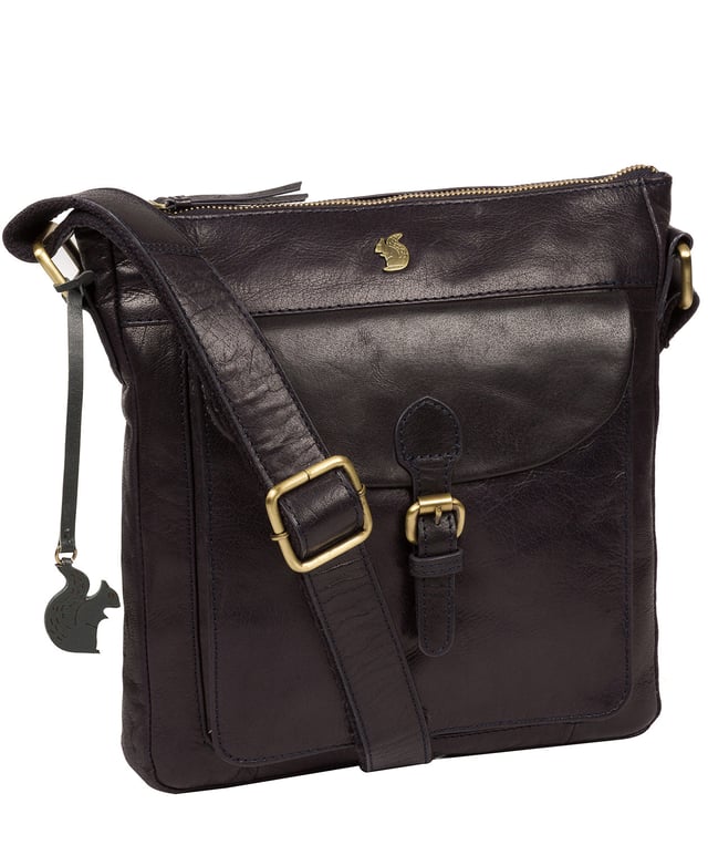 The 'Josephine' shoulder bag from Conkca London is crafted from vegetable-tanned leather for a richly textured finish. The zip-over top conceals a gorgeous, 100% natural, untreated cotton lining and two interior pockets. Featuring a mock buckle, the exterior pocket provides plentiful on-the-go storage. Comes with an adjustable fabric strap and is furnished with gold-coloured metal fittings. Adorned with the inimitable and charming Conkca London squirrel charm and logo for an eye-catching finish.