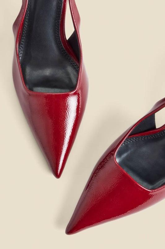 Accessories on point Crafted from luxe crinkle leather in a stunning cherry red patent finishChic slingback with an elasticated insert for a comfortable fit Sexy pointed toe silhouetteSet on a super-wearable flared kitten heel We love them with jeans and a blazer
