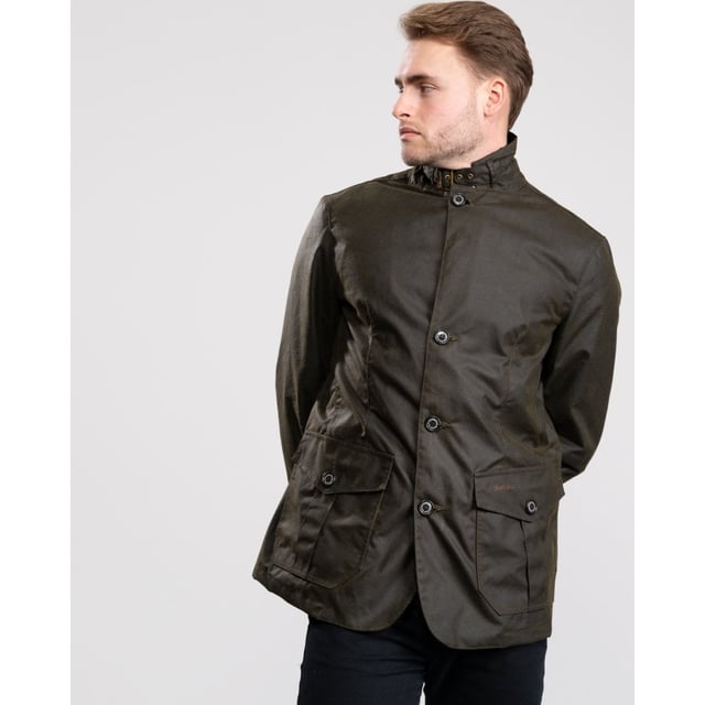 Mens Wax Jacket from the Original Classic Tartan Collection from Barbour. The Lutz Wax Jacket is a traditional mens wax jacket. With two pleated pockets, collar strap fastened with buckle and eyelets and corduroy collar the Lutz features many traditional Barbour details. Tartan cotton lining provides the finishing touch making the Barbour Lutz Mens Wax Jacket a stylish and practical option.
&nbsp;

8oz Oban, 100% Waxed Cotton
100% Cotton Barbour Tartan inner lining
100% Polyester in sleeve linings
Action back detail with stitched down half belt detail.
Sponge clean only
Back length: 27.5-31ins | 69.5-79.5cms