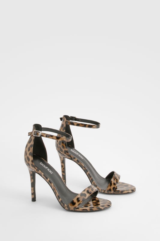 Striking leopard print design for a bold statement
        Sleek ankle strap with adjustable buckle fastening
        Elegant high heel measuring between 7 and 9cm
        Minimalist single strap across the toes for a modern look
        Versatile silhouette suitable for various outfits and occasions
    
    Make a fierce impression with these eye-catching leopard print heels from Boohoo. Perfect for the fashion-forward woman who loves to stand out, these shoes combine classic style with a wild twist. The slim ankle strap provides secure support, while the single strap across the toes keeps the design sleek and contemporary. Ideal for a night out on the town, these heels will effortlessly take you from dinner to the dance floor. Style them with a little black dress for a timeless look, or pair them with tailored trousers and a silk blouse for a more sophisticated ensemble. Whether you're heading to a cocktail party or a girls' night out, these versatile heels will ensure you're always dressed to impress.