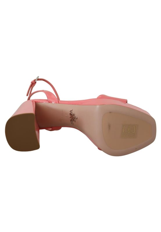 Brand: PRADA
  Condition: Brand new with tags
  Model: Block heels platform sandals
  Color: Pink
  Material: 100% patent leather
  Leather bottom sole for durability
  Logo details showcasing the iconic PRADA brand
  Made in Italy with high craftsmanship
  Exclusive and luxurious design
  Perfect for fashion-forward women
Material: 100% patent leather