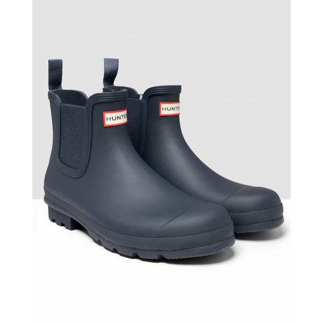 Size/Fit Summary: True to size, Regular fit which features new engineered improvements. If you are in-between sizes or want to wear a thick sock, it is recommended to size up.
The Hunter Original Chelsea Boot has been re-engineered for an improved fit and all-day comfort. A wider ankle circumference, and an increased curve in the heel and around the Achilles tendon delivers an even more comfortable fit.
The new and improved Hunter Original Chelsea Boot has an even more optimum fit to maximise all-day comfort. Ready for rain, each boot is handcrafted from natural rubber and vulcanised for superior protection. Retaining the iconic features of a traditional Chelsea, it features elasticated-gussets and has a nylon pull-tab to make stepping into the boot easy. In a classic black matte, these men's waterproof Chelsea's are a wet weather wardrobe essential.
We recommend that all Hunter Chelsea boots be worn with Hunter Chelsea socks, which have been technically designed to protect the wearer's skin from contact with rubber in specific areas.

Waterproof
Handcrafted
Waterproof
Polyester lining
Rubber outsole with Hunter Original tread pattern
Elastic side gussets and nylon pull-tab
Crafted from natural vulcanised rubber with a matte finish