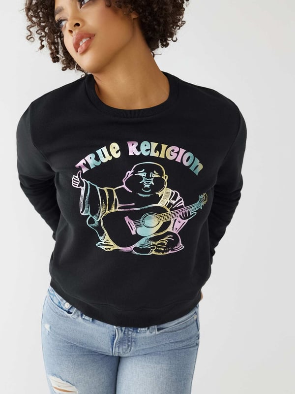 Keep it cute and comfy in the Buddha Crewneck Sweatshirt. Designed from a cozy cotton blend, this women's sweatshirt features a crewneck and multicolor shimmer Buddha graphic across the front.