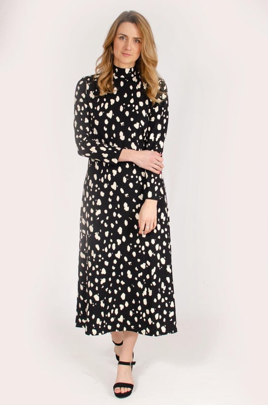 Discover timeless elegance with the Hobbs 'Alcott' Abstract Splash Dot Jersey Dress. Crafted from soft jersey fabric, this dress features a classic stand neck, long sleeves, and a chic black and cream print, making it the perfect choice for both casual and dressier occasions.