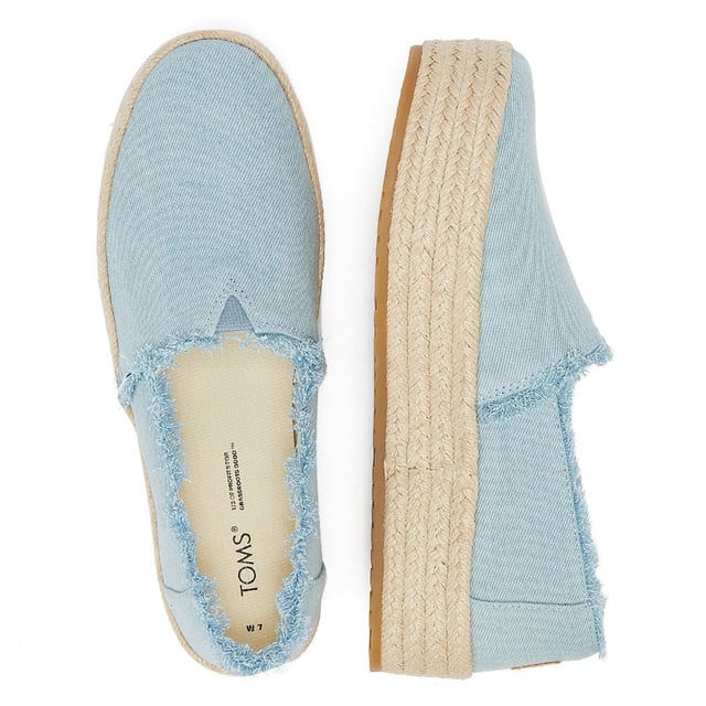Elevate your style with these trendy espadrille platform slip-ons, featuring stylish textile uppers. The rope wrap platform adds a touch of sophistication to these shoes. Enjoy superior comfort with the padded heel that cushions your feet with every step. The OrthoLite Eco LT Hybrid insoles are made with 26% eco content, including 15% waste foam, 5% recycled materials, and 6% bio-oils, ensuring both comfort and sustainability. The rubber outsole offers excellent grip and durability. With an outsole height of approximately 1.5 inches, these slip-ons provide the perfect amount of elevation. Rest assured, these shoes are completely vegan, catering to your ethical choices. Step out in style and comfort with our exceptional espadrille platform slip-ons.