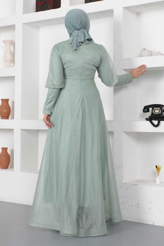 Stoffmerkmal: Hergestellt aus glitzerndem Tüllstoff.Produktmerkmal: Neues Hijab-Modestück der Saison. Gefüttert. Mit einem Rückenreißverschluss für einfaches Anziehen. Mit einem Reißverschluss verziert. Aufgrund von Konzeptaufnahmen kann es leichte Farbabweichungen im Produkt geben. Das Model trägt Größe 38. Größe 38 Abendkleid Maße: Produktlänge: 146 cm - Br