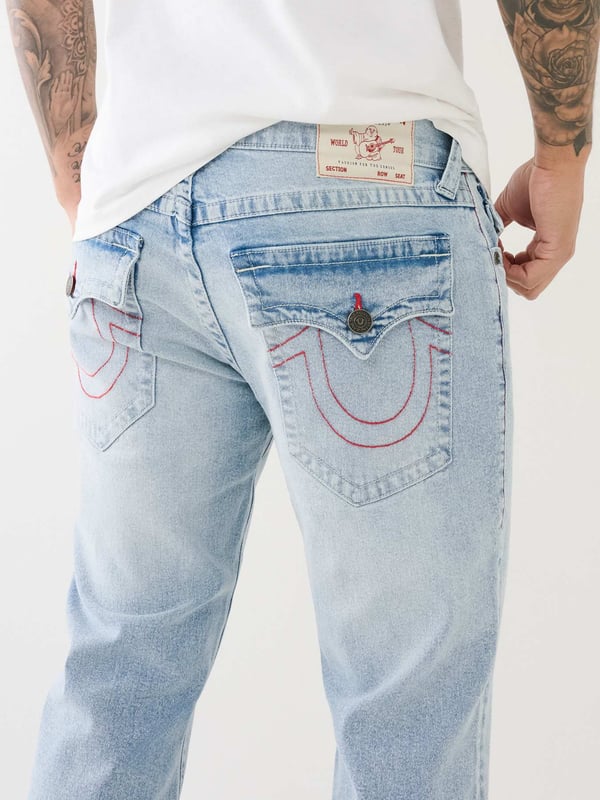 The Ricky Super T Straight Jean is a true classic. This men's straight jean features fading and 3D whiskering, clean hardware, and red and white Super T stitching. Finished with 1/2" horseshoe detailing along the back flap pockets and our regular 34” inseam. 
