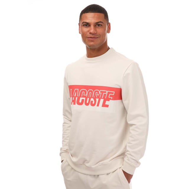 Bold. Colorful. Audacious. A new generation of Active wardrobe. This new style  dedicated to GenZ  have a bold and eye-catching Lacoste print in the middle. Break traditional codes and create a new strong identity with a playful mash up of colors. This sweatshirt is a fashion must-have. Loungewear sweatshirt Regular fit: natural ease on body Lightweight French terry Crew neck Ribbed cuffs and body bottom Bicolor cut and shifted Lacoste branding on chest 