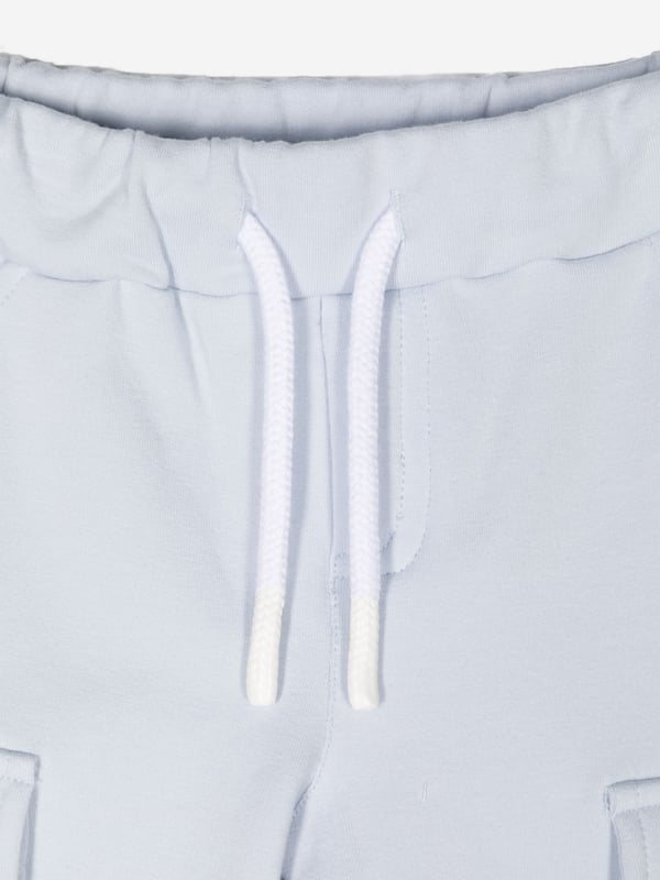 Introducing the Baby Boys Cargo Trousers in Blue from patachou, a luxurious addition for AW2024. Crafted with precision, these trousers are a perfect blend of elegance and comfort for your little one. Key highlights:‚ Rich Blue Hue: A deep, captivating blue that complements any outfit.‚ Premium Fabric: Constructed with high-quality materials for durability and comfort.‚ Versatile Design: Featuring practical cargo pockets and a stylish, adaptable fit.Elevate your child's wardrobe with these chic and functional cargo trousers!