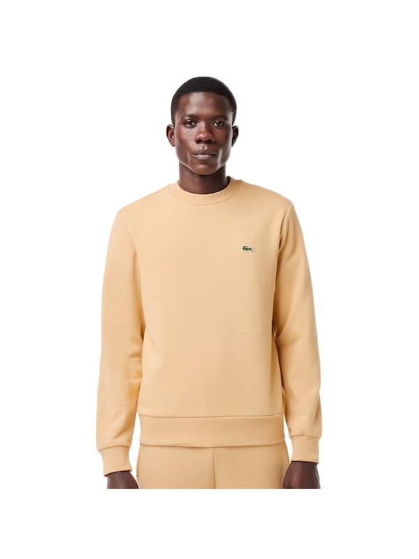 Timeless style renewed every season in a new color palette  in our signature details and a sustainable approach. Classic fit  natural ease on body with comfortable sleeves. Solid crewneck sweatshirt in brushed fleece made of organic cotton and recyled polyester. Piqué necktape in iconic Lacoste green. Embroidered 3cm green crocodile sewn on chest.