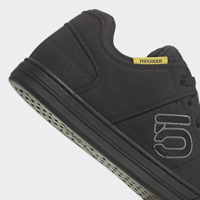 Hit the trail. Ride to work. Hang out. The adidas Five Ten Freerider Canvas Mountain Bike Shoes are as street friendly as they are capable on the bike. A Dotty tread with Stealth® S1™ rubber sets you up for flat pedal control and bike-worthy durability sets you up for the trail. All with a fit and feel that sets the bar for versatile wear on and off the bike.  - Regular fit - Lace closure - Canvas upper - Textile lining - Reinforced toe - Stealth® S1 rubber outsole - Yarn in upper contains at least 50% Parley Ocean Plastic  and 50% recycled polyester  Shipped by adidas
