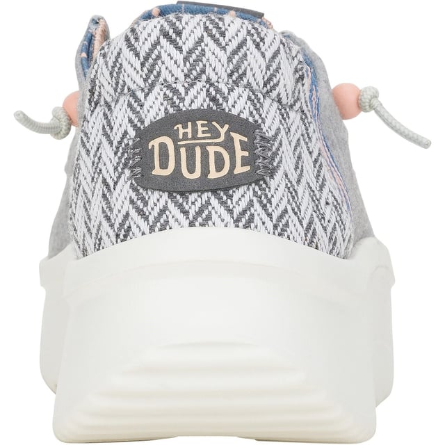 Up your style game with Wendy Peak Chambray Woven. Added, cushy comfort and height meets woven textile heel and webbing details for the perfect mix of comfort and style. So easy to put on you'll never wanna take 'em off.