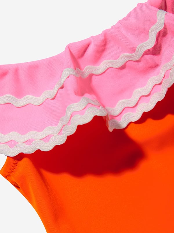 Nessi Byrd incorporate captivating materials into their everyday luxury swimwear. This girls Pina orange and pink swimsuit is reflective of the New York label's meticulous attention and preference for vibrant aesthetics. The top is depicted with a ruffled top and a bordered belt with a crochet flower accessory. Elasticated 80% Polyamide 20% Elastane