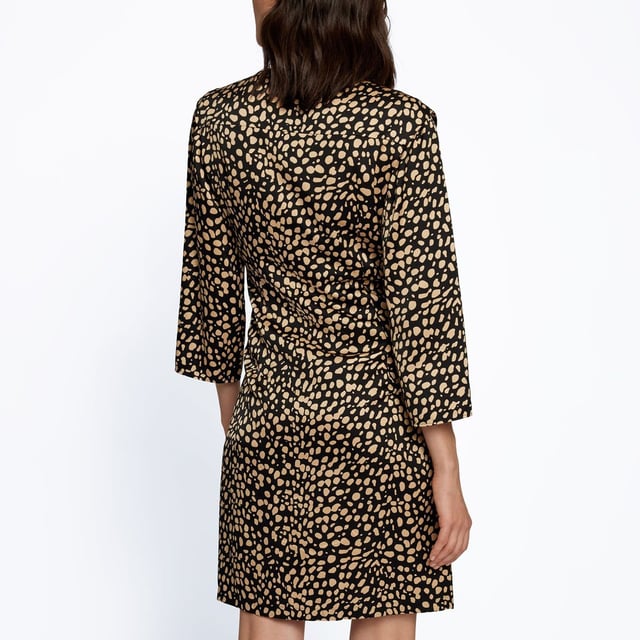 Constructed with long sleeves and a V neckline for a classic look  it features elasticated hems for a comfortable fit. This dress is an all over print design with a signature logo and is complete with BOSS branding.