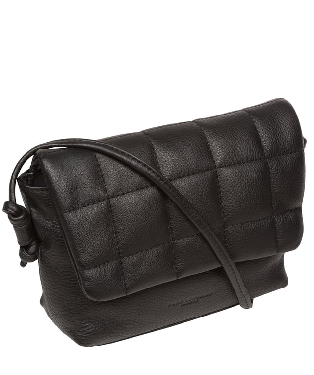 The 'Zoey' cross body bag from the Pure Luxuries London Marylebone Collection is handcrafted from high-quality, genuine Nappa leather with a natural super-soft touch. The fold-over top features an eye-catching quilted design and is secured by a magnetic press stud. The interior is lined with 100% cotton and includes two card slots, to help keep maintain an organised bag. Comes with an adjustable slim leather strap, with a drop length of 65cm. The Pure Luxuries logo is embossed in gold foil for a beautifully simple finishing touch.