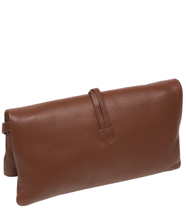 The 'Selene' cross body clutch bag from the Pure Luxuries Marylebone Collection is handcrafted from high-quality, genuine Nappa leather with a natural super-soft touch. The fold-over top secured by two magnetic press studs, opens to reveal a zipped main compartment and a slip pocket. The interior is lined with 100% cotton and includes two slip pockets to help maintain an organised bag. Comes with a matching and adjustable slim leather strap, with a maximum drop length of 65cm. The strap is also removable, transforming the bag into a clutch bag. Features gold-coloured metal fittings and zip. The Pure Luxuries logo is embossed for an effortless and sophisticated finishing touch.