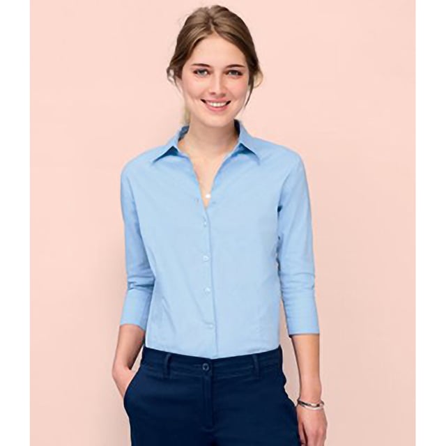 Stretch fabric. Stiffened collar. Self colour buttons. Slitted cuffs. Front and back darts. Curved hem. Fabric weight: 140 gsm. Material: 97% cotton/3% elastane. Ladies size: XS(6/8), S(8/10), M(10/12), L(12/14), XL(14/16), XXL(16/18).