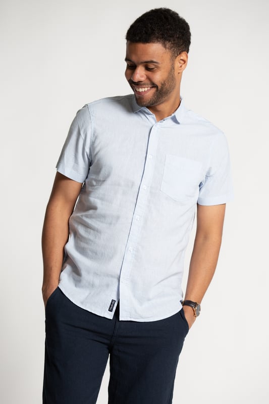 Blue Linen Blend Short Sleeve Button-Up Shirt With Chest Pocket Upgrade your summer wardrobe with this short-sleeved, linen shirt from Tokyo Laundry. Made from a breathable blend of linen and cotton, this shirt offers comfort and style with its classic fit. The shirt features button fastening and a chest pocket. Machine washable for easy care.