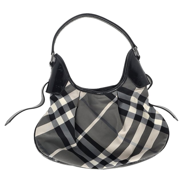 VINTAGE, RRP AS NEW
Make a statement with the Burberry Beat Check Shoulder Bag in Black Nylon. The signature grey plaid print is complemented by patent leather trim and silver-tone hardware for a chic, elevated look. With a single shoulder strap and dual interior pockets, this bag is not only stylish but also practical, providing the perfect blend of form and function.


Burberry Beat Check Shoulder Bag in Black Nylon
Condition: very good
Signs of wear: No retail tag, No visible sign of wear.,  Light wear
Packaging: None
Color: black
Material: nylon
Size: One Size | One Size
Measurements: Width: 70; Height: 210; Length: 350; Handle drop: 20
SKU: NAPPUGBBA426807W