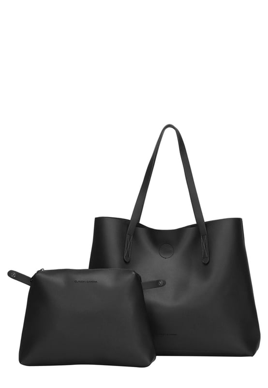Let simplicity be key with the Ophelia tote bag, perfect for taking your look through the week. In a range of colours this tote is made from unlined PU making it lightweight and spacious. With simple design features such as the Claudia Canova debossed logo, this bag is perfect for everyday sleek style. The bag fastens with a mag-dot clasp and inside reveals an inner pouch with a zip fastening to keep all your daily essentials safe. Features: , Unlined PU, Claudia Canova debossed logo, Mag-dot clasp fastening, Twin grab handles, Soft and flexible shape, Removable inner pouch with zip fastening Style Ref: 84395